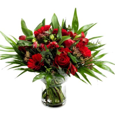 Blomster red n´ faboules Skøn tæt buket i røde nuancer. Bundet af floristen.